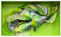 Crystal Wagners vibrant abstract sculpture, featuring intricate layered paper cutouts in green, yellow, and white resembling organic plant-like forms on a bright green background, is showcased by Spoke Art.