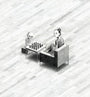 A child and a small skeleton sit facing each other in armchairs with a chessboard between them, evoking The Seventh Seal on a textured checkered floor. The childs gaze enhances the surreal scene captured by Jonas Lofgren.