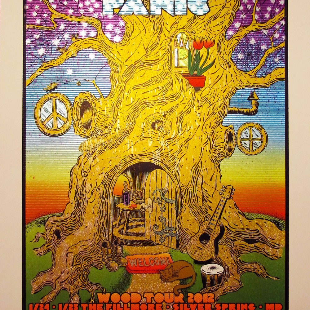 Colorful concert poster by Chuck Sperry for Widespread Panics 2012 tour features a large tree with peace signs, a guitar, flowers, and an open door. This vibrant retrospective print lists event locations and dates at the bottom.