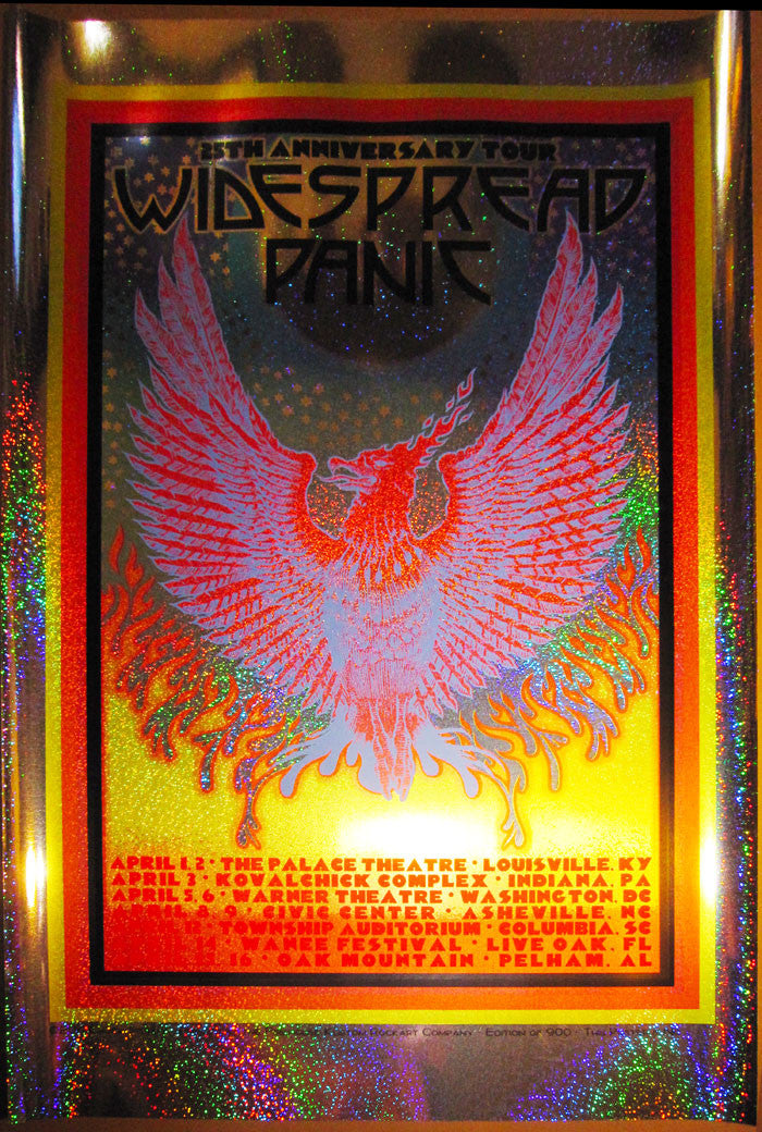 A vibrant concert poster by Chuck Sperry features a phoenix illustration and sparkle holographic foil. It reads 25th Anniversary Tour, Widespread Panic with venue details below, all set against a metallic, colorful background that completes this anniversary tour masterpiece.