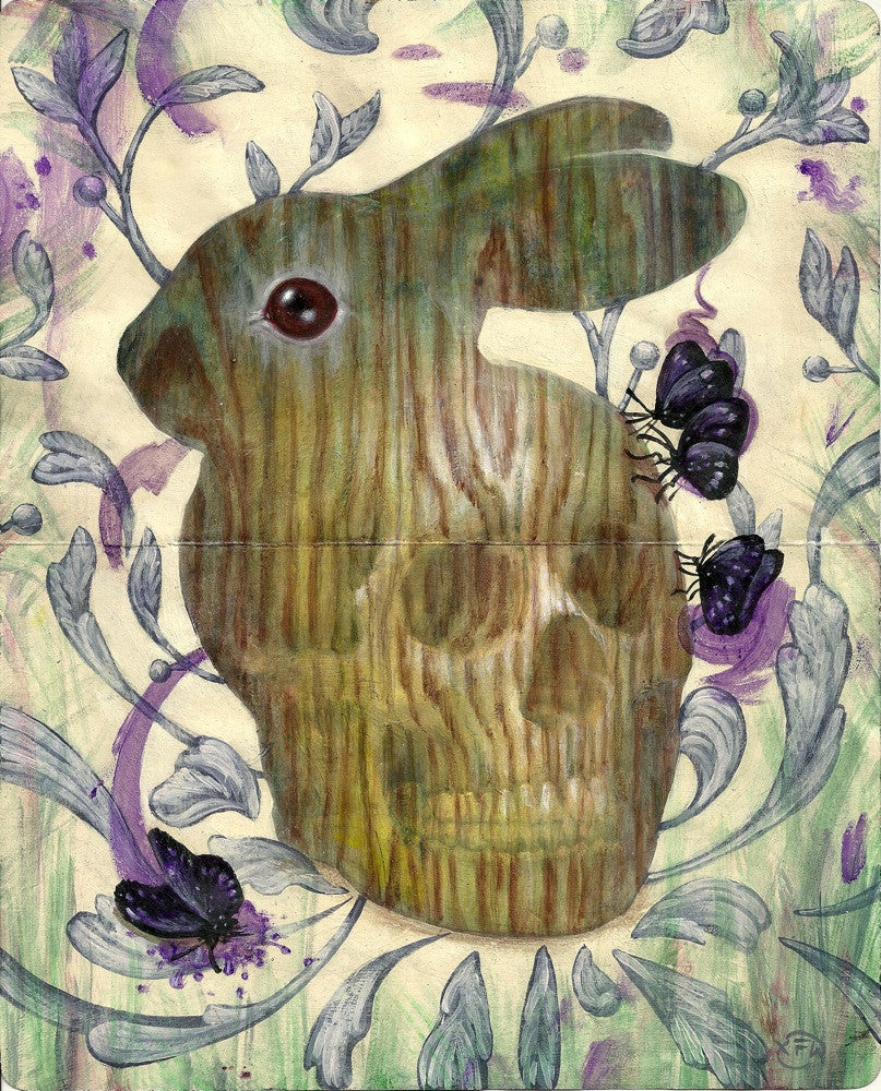 A wooden rabbit sculpture featuring a subtle skull pattern is surrounded by purple flowers and butterflies. Green and purple floral swirls fill the background, capturing Xiau-Fong Wees vibrant style, while acrylic on Moleskine techniques enhance the lively scene.